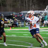 Midland-Dow's Chase Mahabir looks to shoot during a game against Clarkston on April 9, 2021.
