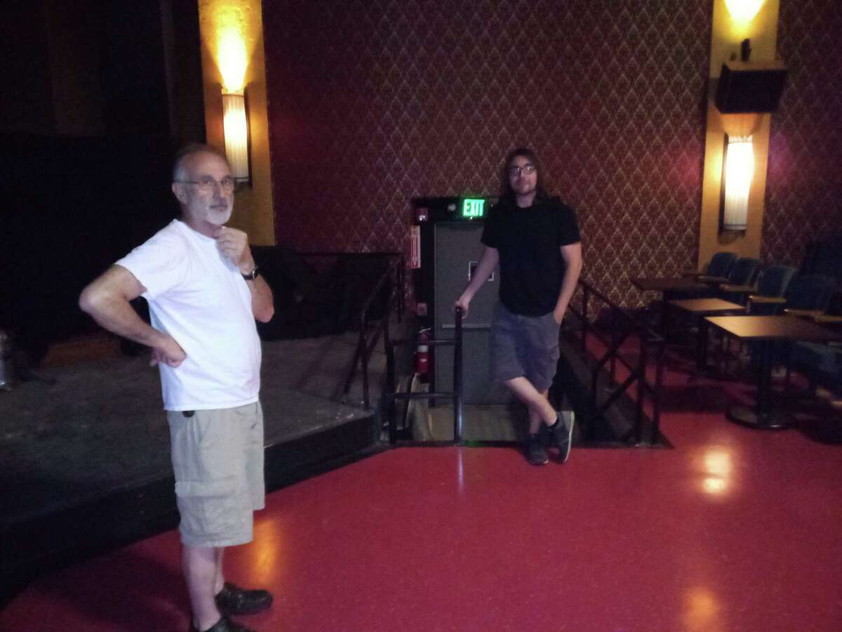 Alan Nero and his son Alan Nero Jr. are planning a series of concerts in their Gilson Cafe & Cinema for the summer.  Nero, left, and Nero Jr., right, stand in the main space of the theater, where a stage and dance floor are ready for guests.