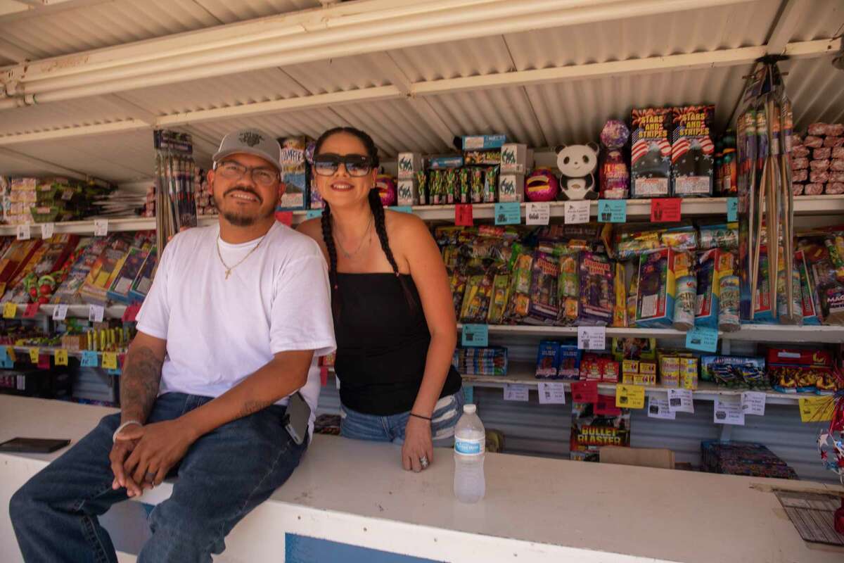 Christopher and operator Lisa Gonzalez pose for a portrait Thursday, July 1, 2021 at Mr. W Fireworks stand along State Highway 349. Jacy Lewis/Reporter-Telegram