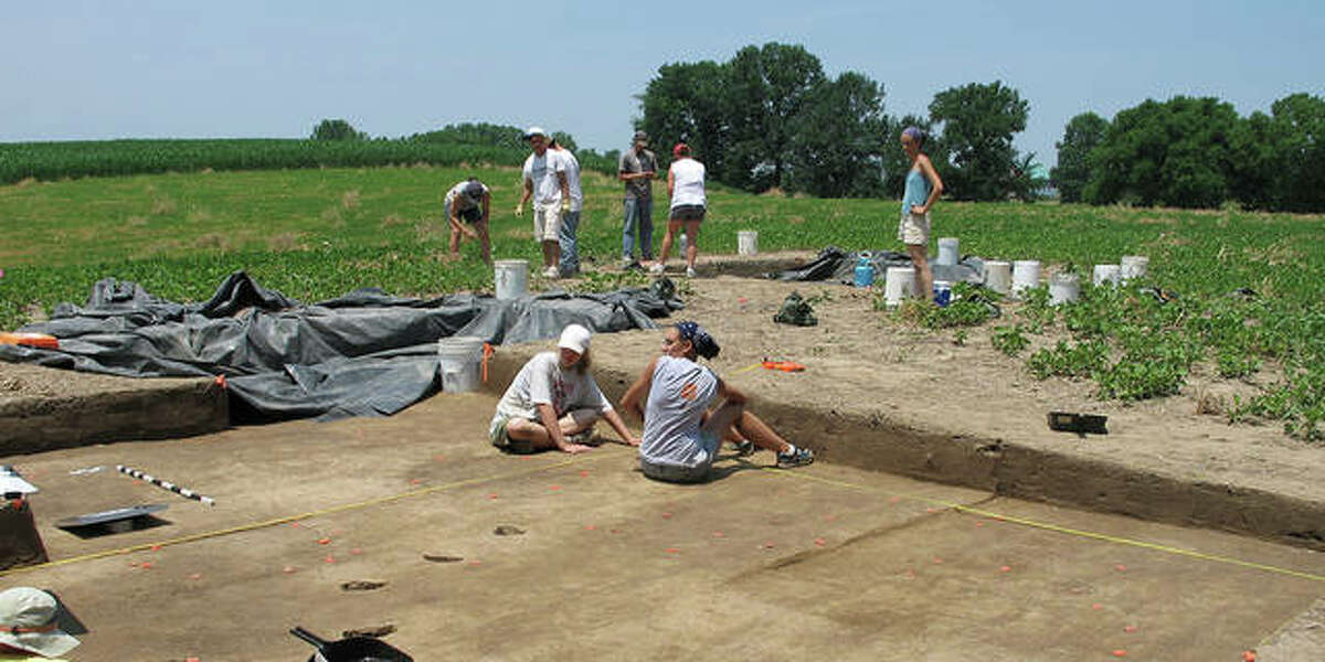 Students work at an archaeology dig with anthropology professor Julie Zimmermann.