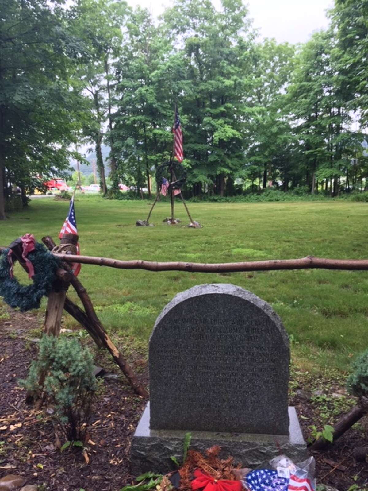 A memorial marker dedicated to the American soldiers who died at the Fishkill Supply Depot during the Revolutionary War. Preservationists seeking to prevent development of the site claim scores if not hundreds of soldiers were buried at this site. The property's owner, developer Domenic Broccoli, disputes that claim. (Photo taken June 22, 2021 in Fishkill, NY.)