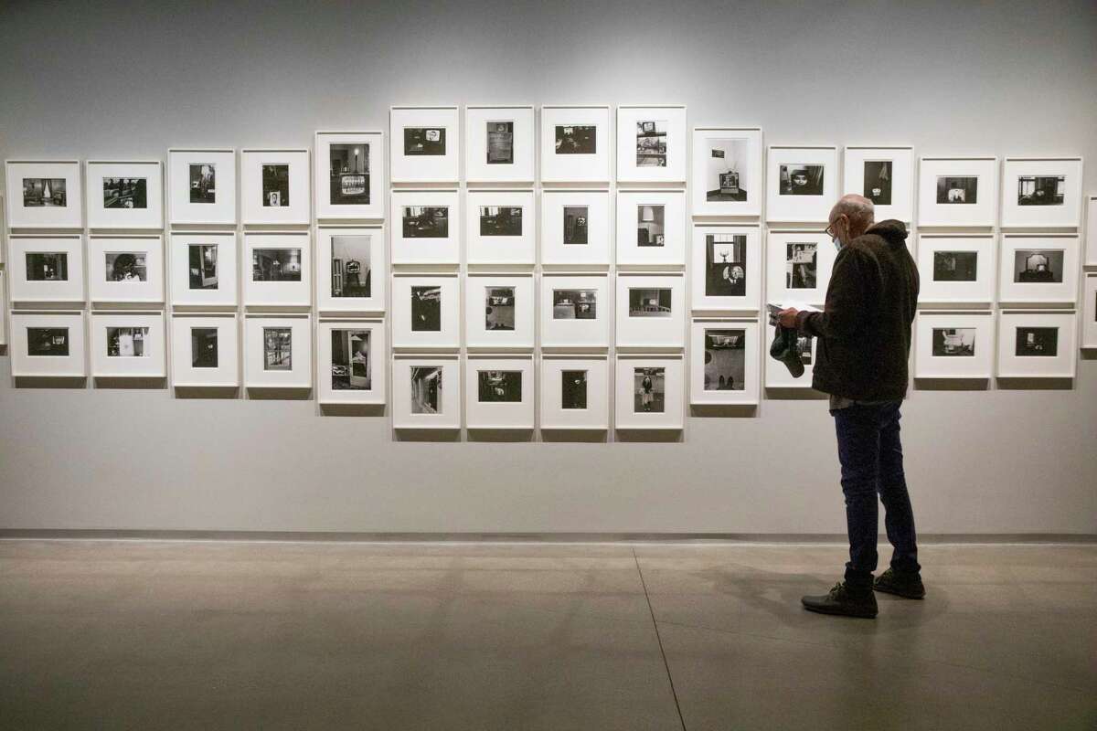 Keith Silva views “The Little Screens,” by Lee Friedlander, at Pier 24 Photography on Thursday in San Francisco. The reopening exhibition is “Looking Back,” a retrospective on the private museum’s first decade.