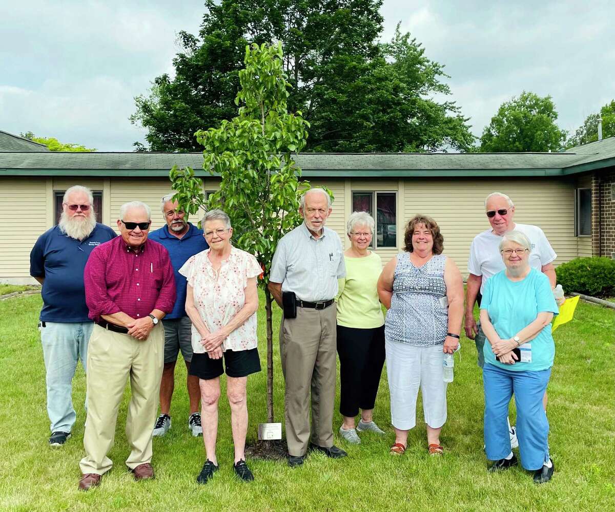 Members of the Montcalm County Housing Commission recently planted a Cleveland blossoming pear tree in honor of chairman and commissioner Richard Stevens. The tree was planted at Mulberry Estates.(Submitted photo)