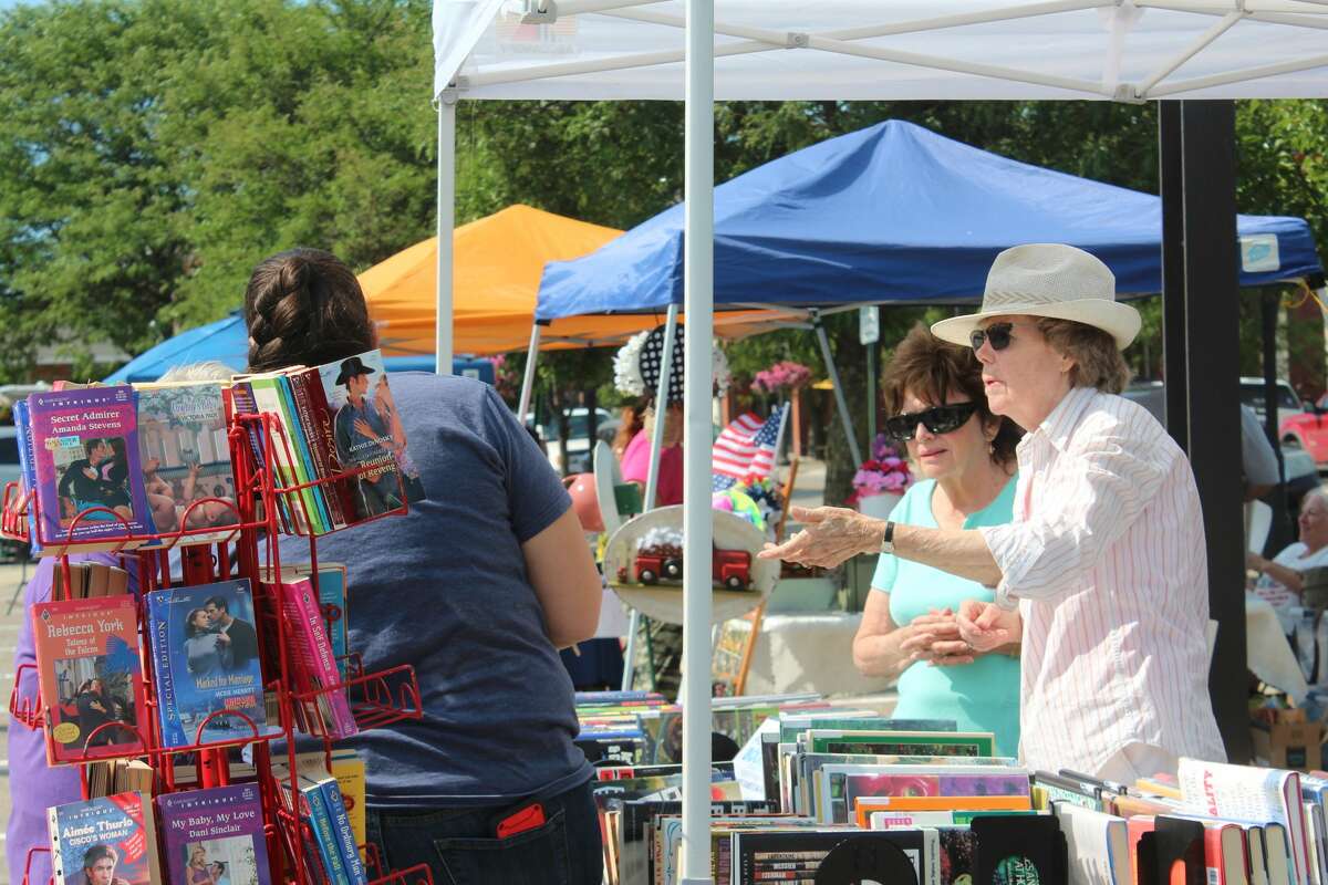 The hot summer sun brought out more visitors to check out vendors at Friday's Farmer's Market in downtown Big Rapids. 