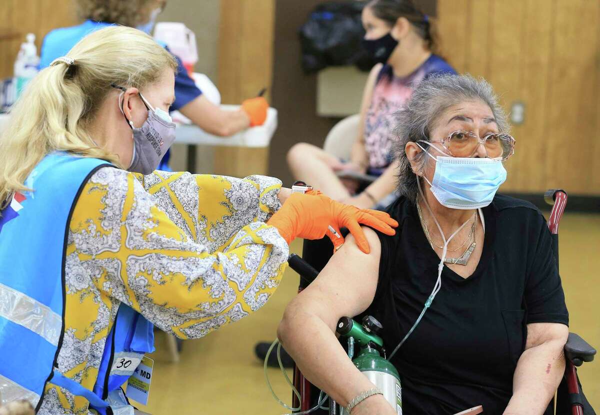 Mary Ruppel gets a COVID-19 vaccine at St. Vincent de Paul Columbus Club on the Southwest Side.