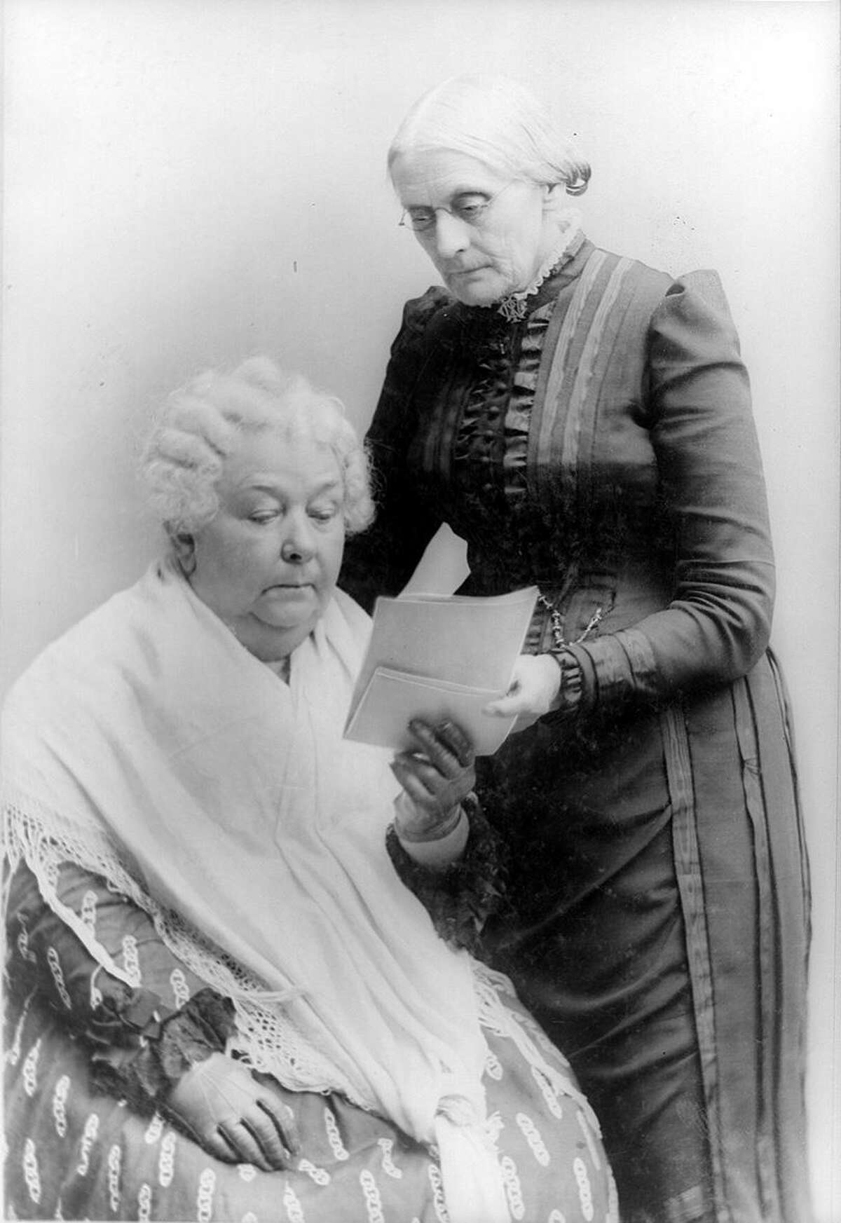 Elizabeth Cady Stanton, seated, and Susan B. Anthony, standing, both attended the first Women's Rights convention held in Seneca Falls, New York, in July of 1848. Seen here, photographed together, sometime between 1880 and 1902.