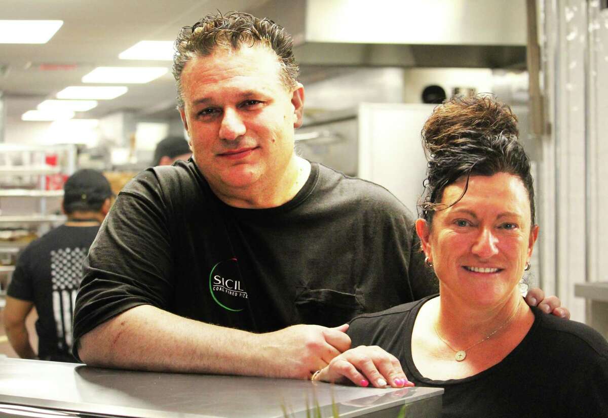 Tony and Maria Prifitera launched Sicily Coal Fire Pizza at 412 Main St. in Middletown Monday in the old R.W. Camp’s department store building. They want customers to know they serve much more than Italian pies in the 10,000-square-foot eatery.