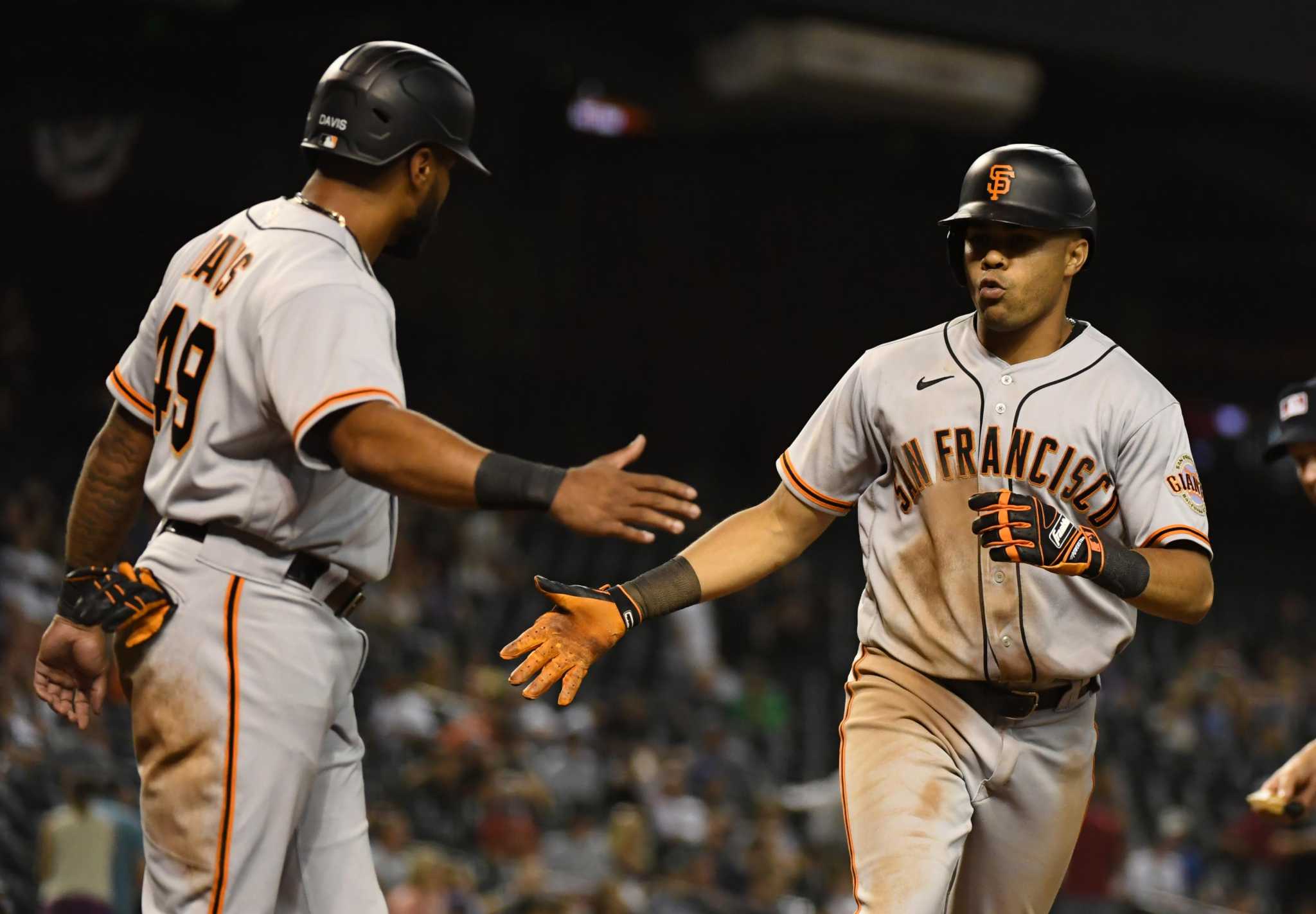 Brandon Crawford and LaMonte Wade Jr. #31 of the San Francisco Giants  News Photo - Getty Images