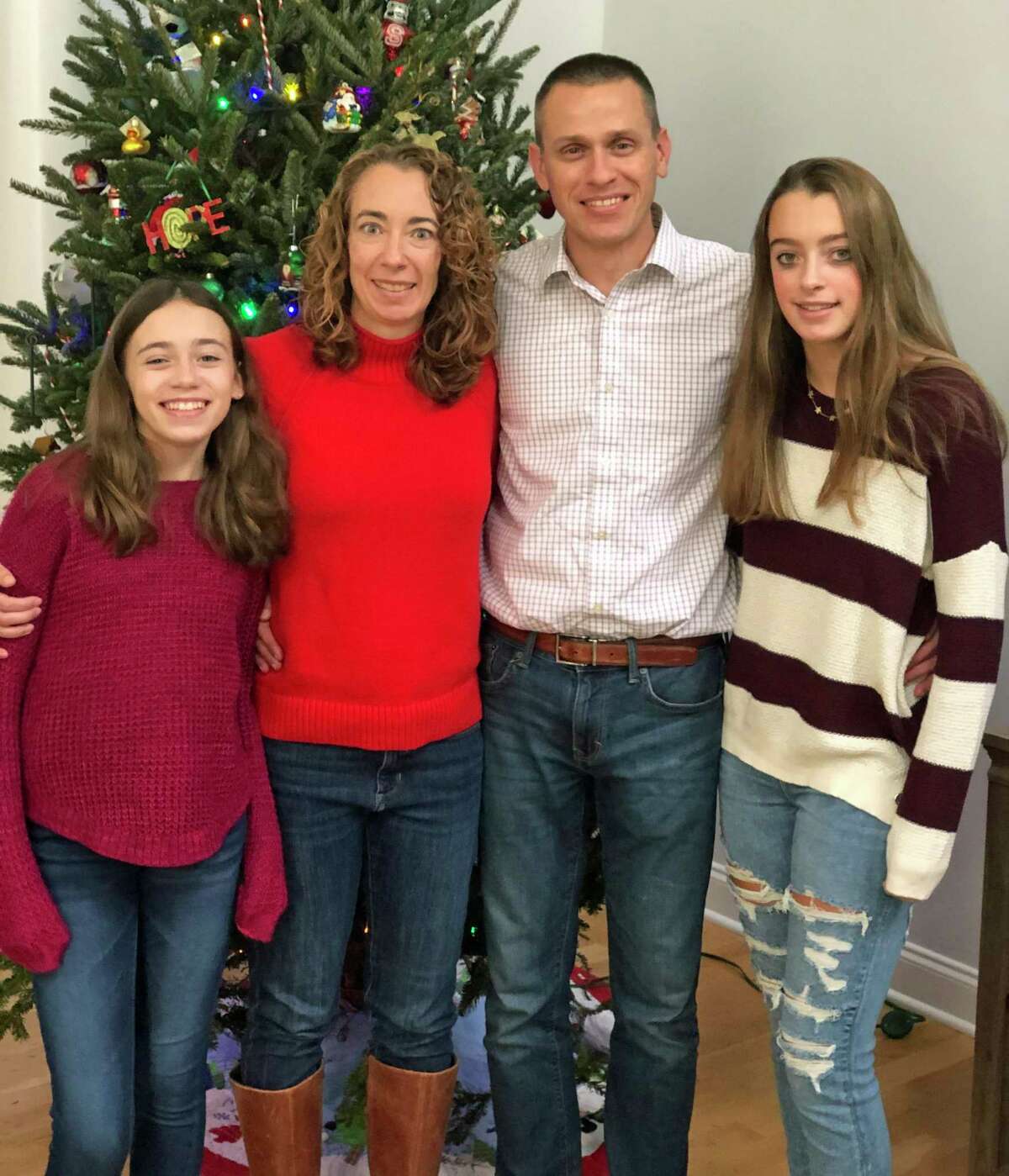 Kyle and Lindsey Rogers-Seitz, with their daughters Riley, left, and Kaylyn.
