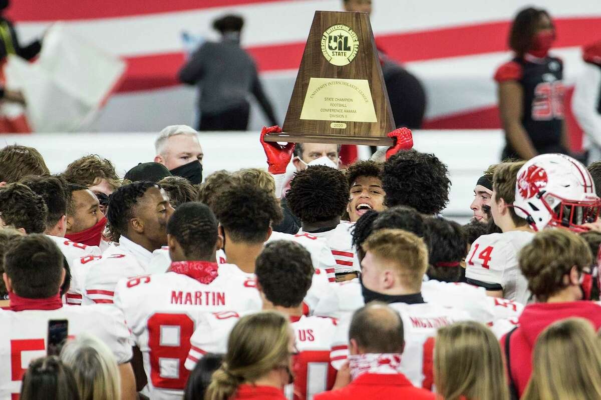 The Katy football team celebrates their 51-14 win over Cedar Hill to capture the Class 6A Division II UIL State Championship at AT&T Stadium Saturday, Jan. 16, 2021, in Arlington, Texas.