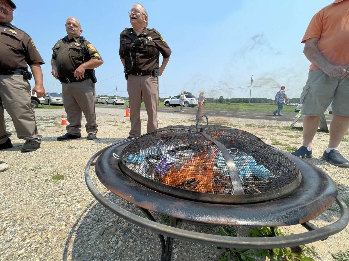 The Morley Community Center hosted a COVID-19 mask-burning party on Saturday. Prior to the burning, members of the Stanwood Lions Club honored Dan Deyo with a special plaque for 53 years of service with the Morley Area Fire Department.