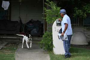 Postal workers brave the rain, the heat — the dog attack