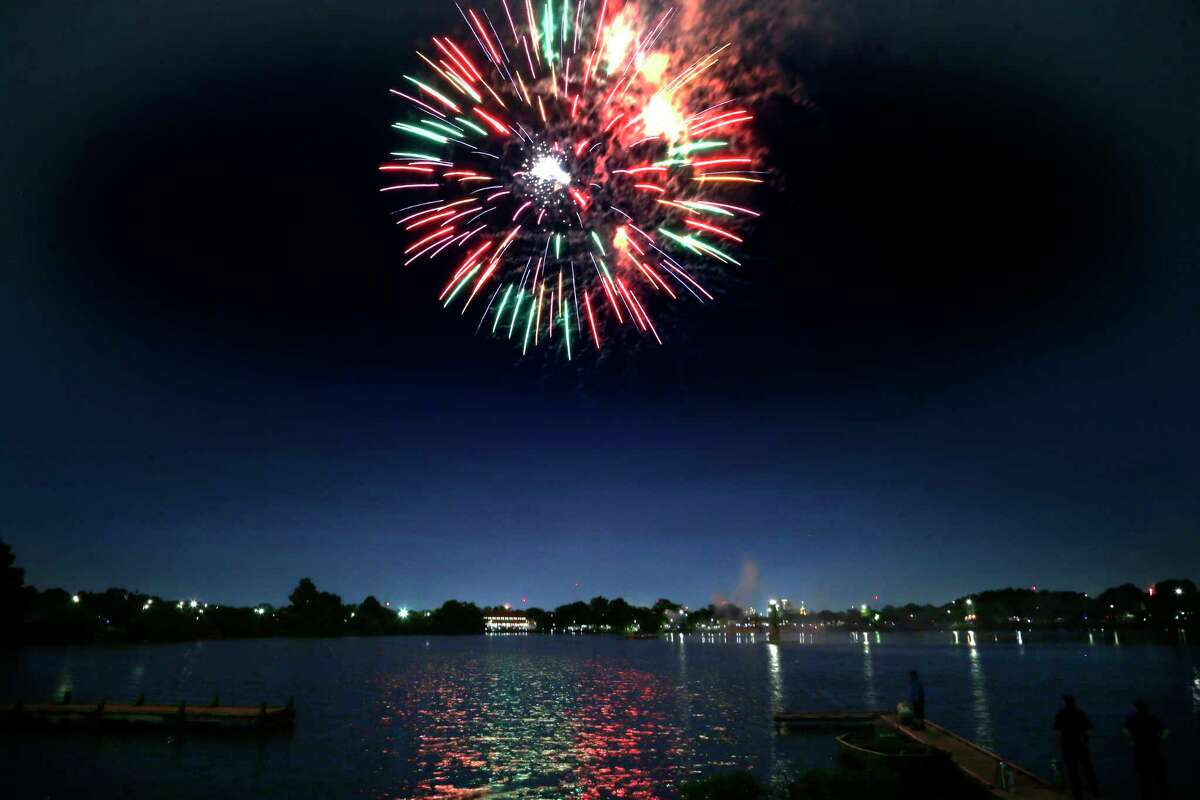 Fireworks over the Woodlawn lake on Sunday, July 4, 2021 at Woodlawn Lake Park.