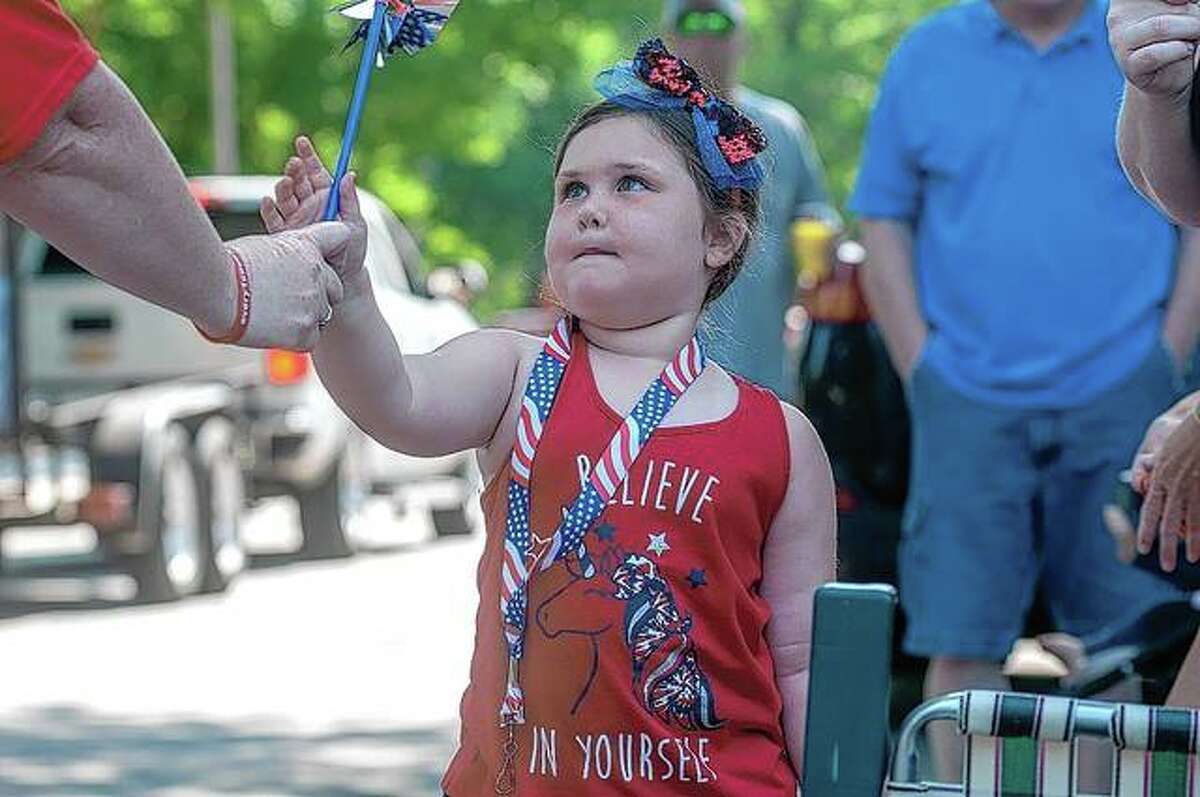 After 18 months of pandemic restrictions, communities across the region this weekend rang in the first holiday since crowds were allowed to gather. During the Jacksonville Rotary Club’s July Fourth Parade, Makenna Kaufmann, 4, enjoyed the marchers making their way along State Street. (More photos from the parade available at myjournalcourier.com)