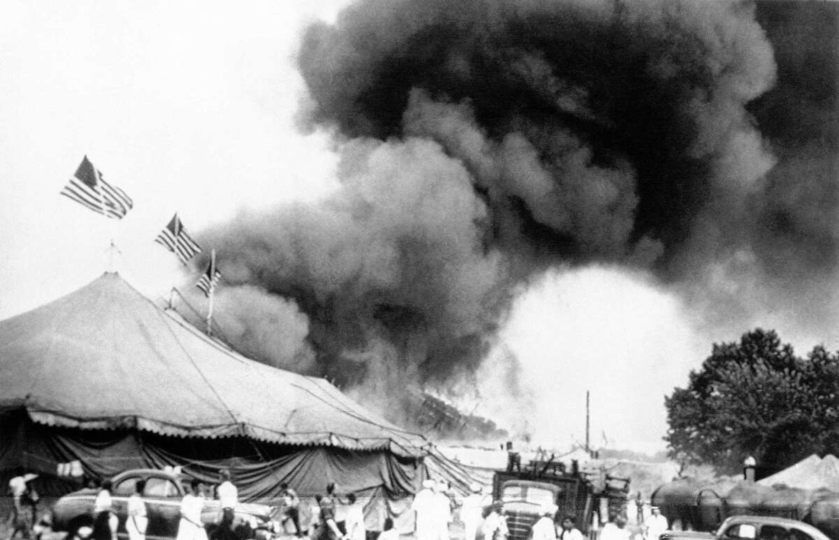 In this July 6, 1944, file photo, people flee a fire in the big top of the Ringling Bros. and Barnum & Bailey Circus in Hartford, Conn.