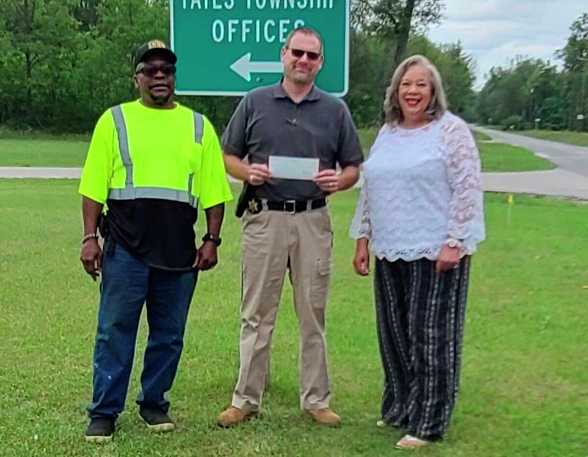 Sheriff Rich Martin (center) presented Yates Township officials with a donation of $2,000 from the Sheriff's Department Charities recently. (Submitted photo)