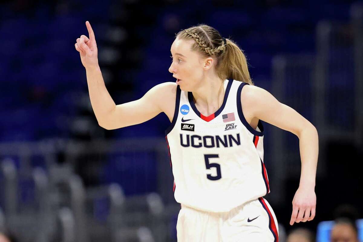 SAN ANTONIO, TEXAS - MARCH 27: Paige Bueckers #5 of the UConn Huskies reacts to a basket against the Iowa Hawkeyes during the first half in the Sweet Sixteen round of the NCAA Women's Basketball Tournament at the Alamodome on March 27, 2021 in San Antonio, Texas. (Photo by Carmen Mandato/Getty Images)