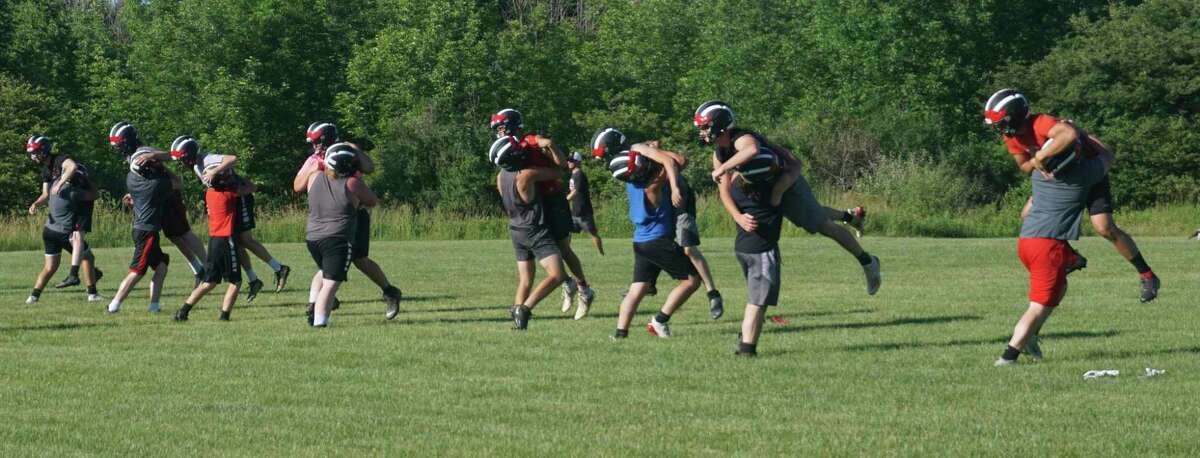 Members of the Reed City football team work on their form during a recent practice. (Pioneer file photo)