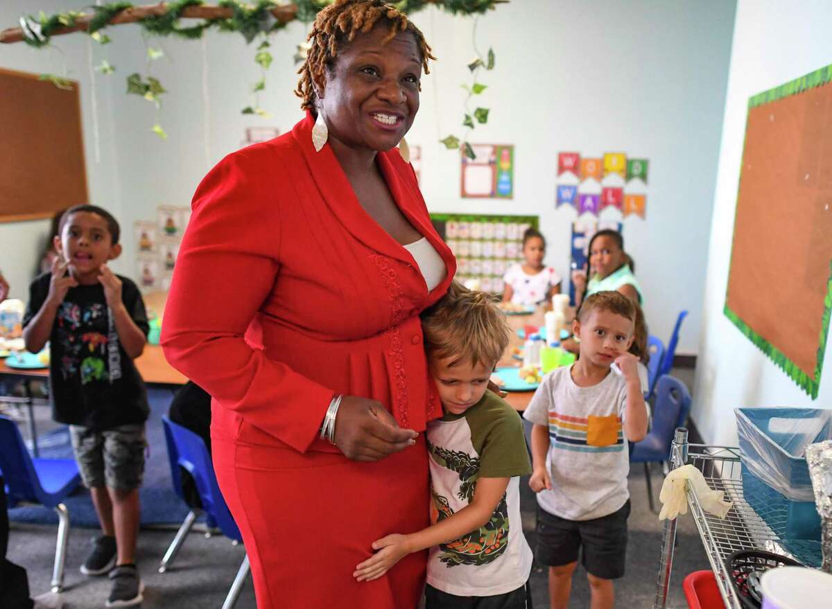 Raphaela Bailey visits with children at Bailey’s Child Development Center on the Northeast Side on Thursday, July 1, 2021.