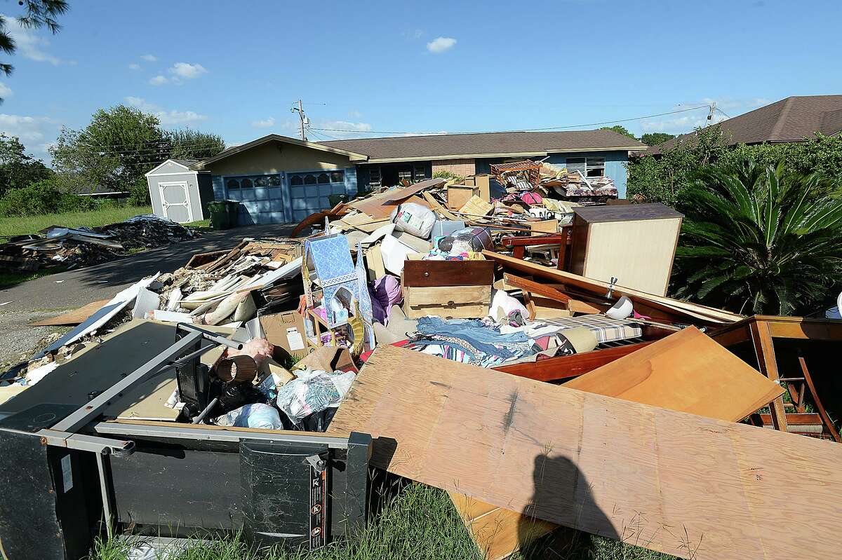 Piles of debris still line the roadways throughout the El Vista neighborhood of West Port Arthur. Thousands of homes in Port Arthur may be required to elevate to rebuild according to new flood plane elevation requirements set by FEMA. A meeting was held Friday night to discuss the issue and inform residents who will be affected. Photo taken Wednesday, October 4, 2017 Kim Brent/The Enterprise