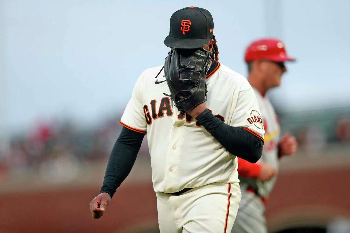 San Francisco Giants' Johnny Cueto yells into his glove after top of 4th inning where St. Louis Cardinals' Paul Goldschmidt hit a 2-run single during MLB game at Oracle Park in San Francisco, Calif., on Tuesday, July 6, 2021.