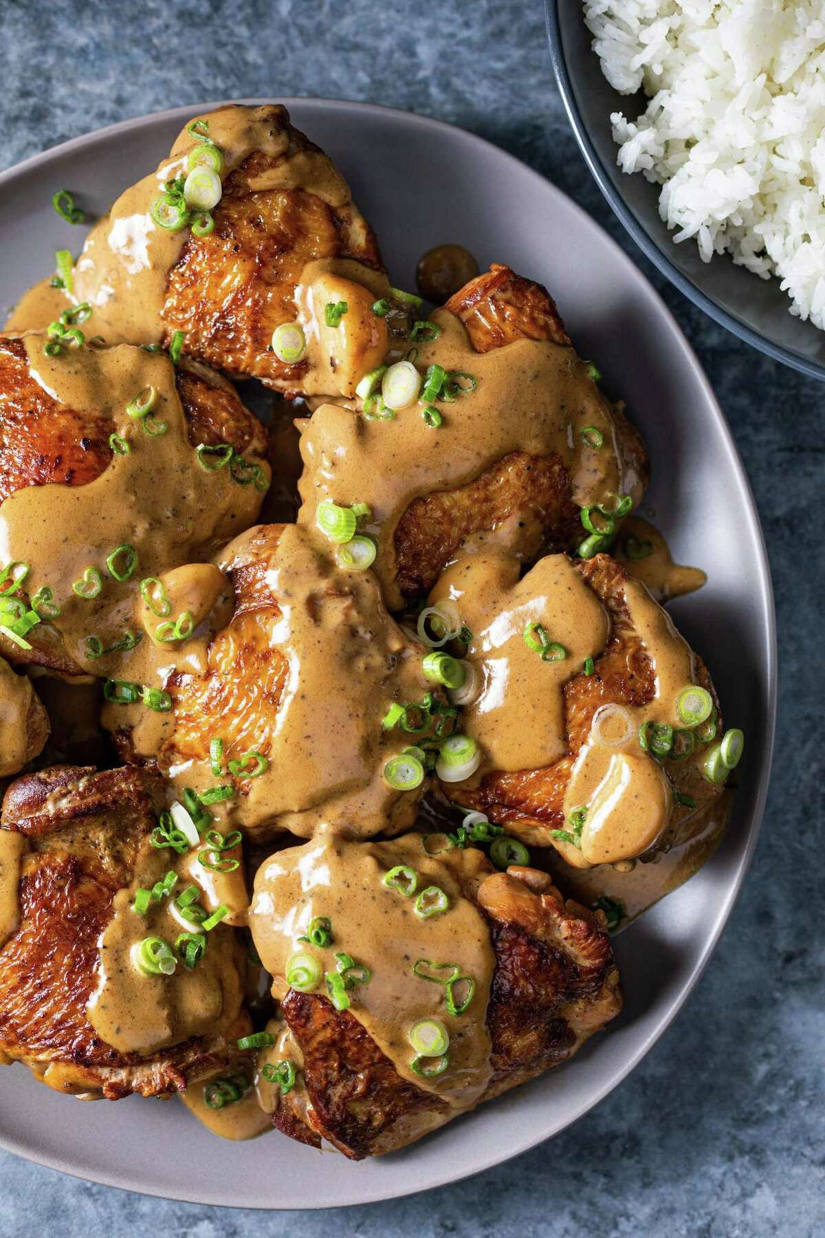 Filipino Chicken Adobo is make with coconut milk, vinegar and chicken thighs from "The Chicken Bible" from America's Test Kitchen.