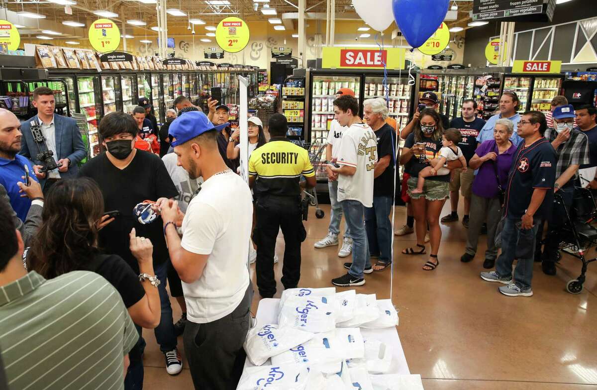 Fans wait to meet Houston Astros first baseman Yuli Gurriel (10) and pitcher José Urquidy (65) during a COVID-19 vaccination drive event Monday, July 5, 2021, at a Kroger location in Houston.