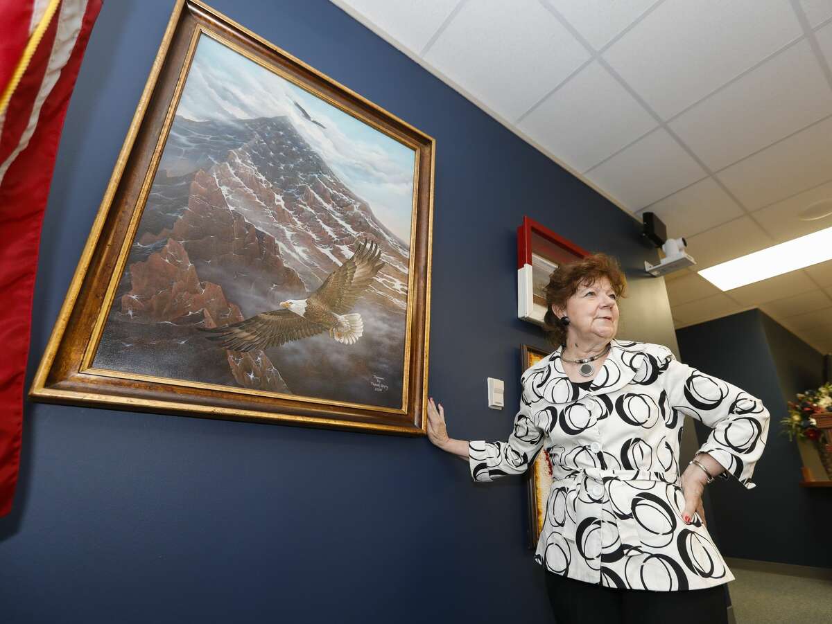 359th state District Court Judge Kathleen Hamilton shares the story behind a painting titled 'Freedom' done by a man convicted in 2004 of felony drug charges that is now displayed in her courtroom, June 30, 2021, in Conroe.