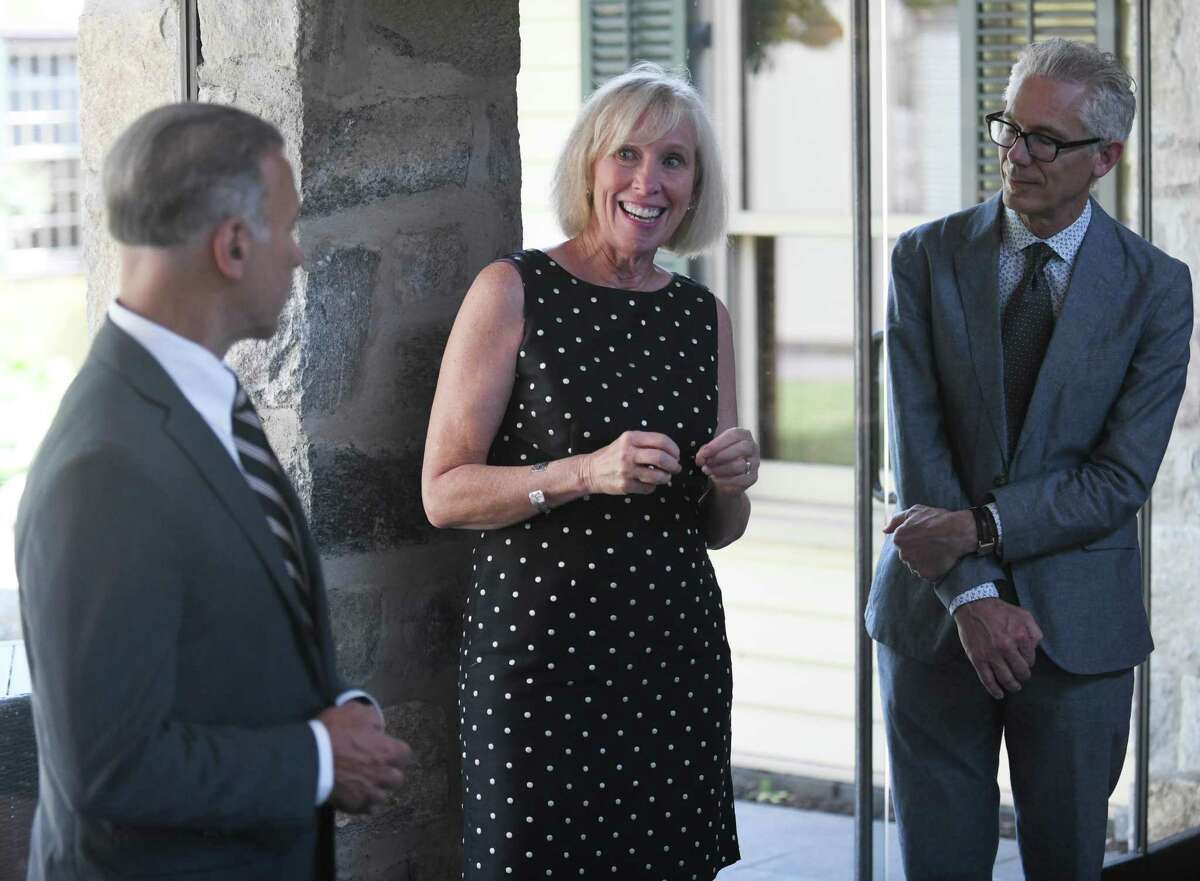 First Selectman Fred Camillo, left, Greenwich Historical Society Executive Director Debra Mecky, center, and Bruce Museum Executive Director Robert Wolterstorff promote the state's Summer at the Museum program at the Greenwich Historical Society in the Cos Cob section of Greenwich, Conn. Wednesday, July 7, 2021. The initiative enables Connecticut children 18 and under, plus one accompanying adult, to receive free admission at museums throughout the state this summer. Greenwich Historical Society and more than 90 other participating Connecticut museums were awarded a substantial grant from the state and federal COVID relief funds as part of the Gov. Lamont's plan to provide children and families with engaging summer enrichment and learning experiences in the wake of the COVID-19 pandemic.