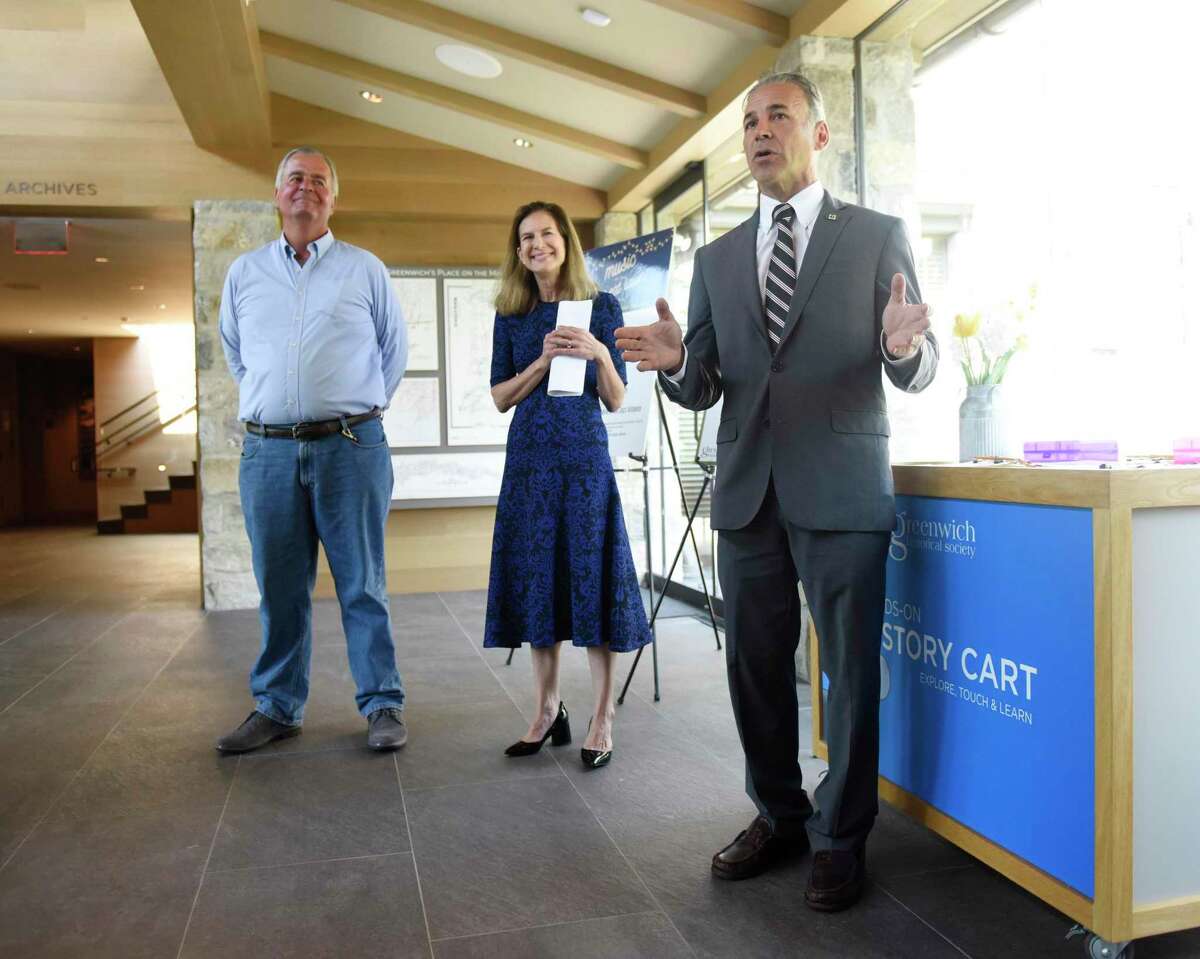 State Rep. Steve Meskers, D-Greenwich, left, Connecticut Lt. Gov. Susan Bysiewicz, center, and First Selectman Fred Camillo promote the state's Summer at the Museum program at the Greenwich Historical Society in the Cos Cob section of Greenwich, Conn. Wednesday, July 7, 2021. The initiative enables Connecticut children 18 and under, plus one accompanying adult, to receive free admission at museums throughout the state this summer. Greenwich Historical Society and more than 90 other participating Connecticut museums were awarded a substantial grant from the state and federal COVID relief funds as part of the Gov. Lamont's plan to provide children and families with engaging summer enrichment and learning experiences in the wake of the COVID-19 pandemic.