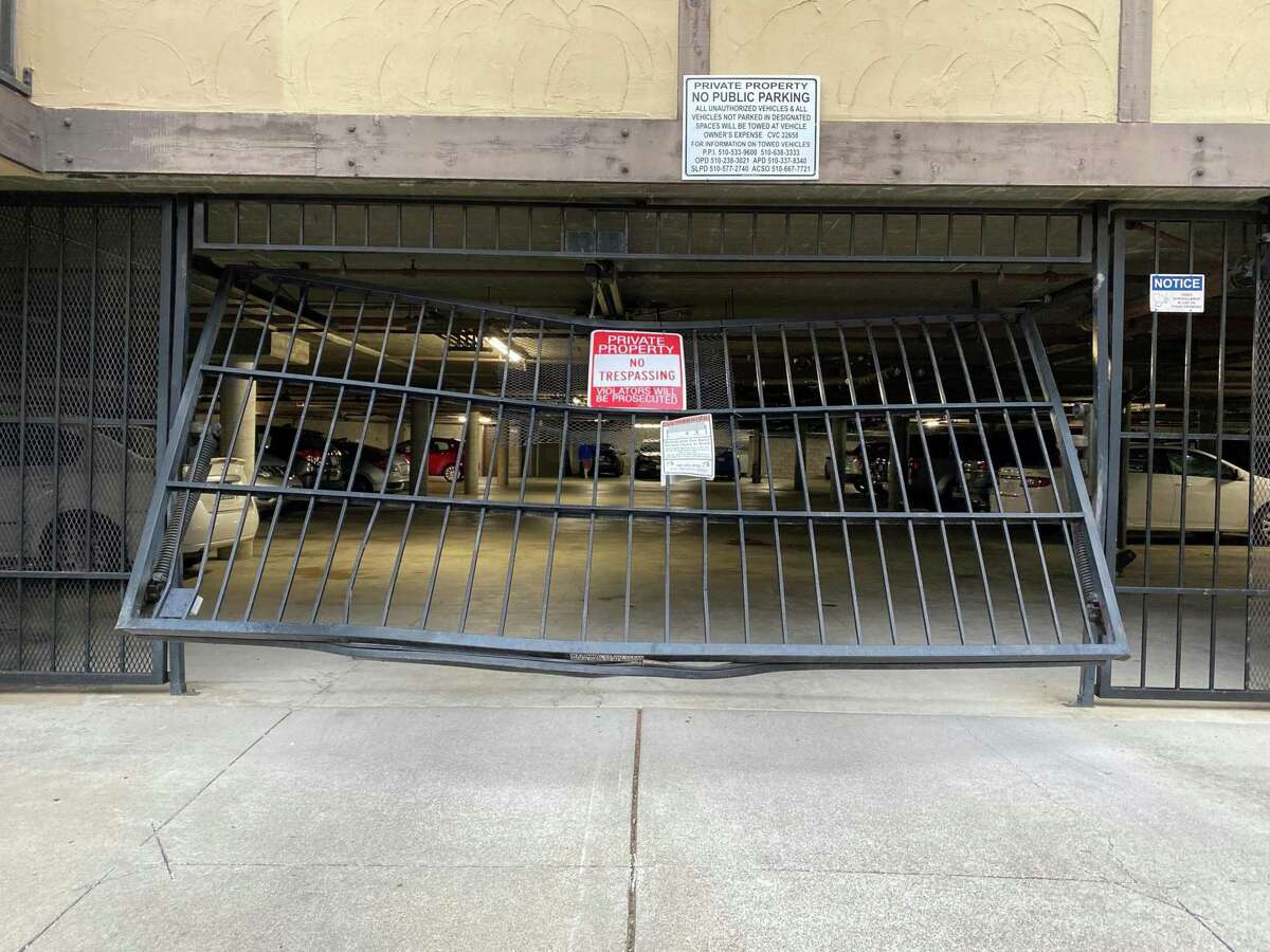 Suspected catalytic converter thieves drove through this San Leandro parking garage gate Tuesday, ramming into and injuring a police officer while fleeing arrest Tuesday, police said. The officer suffered minor injuries.