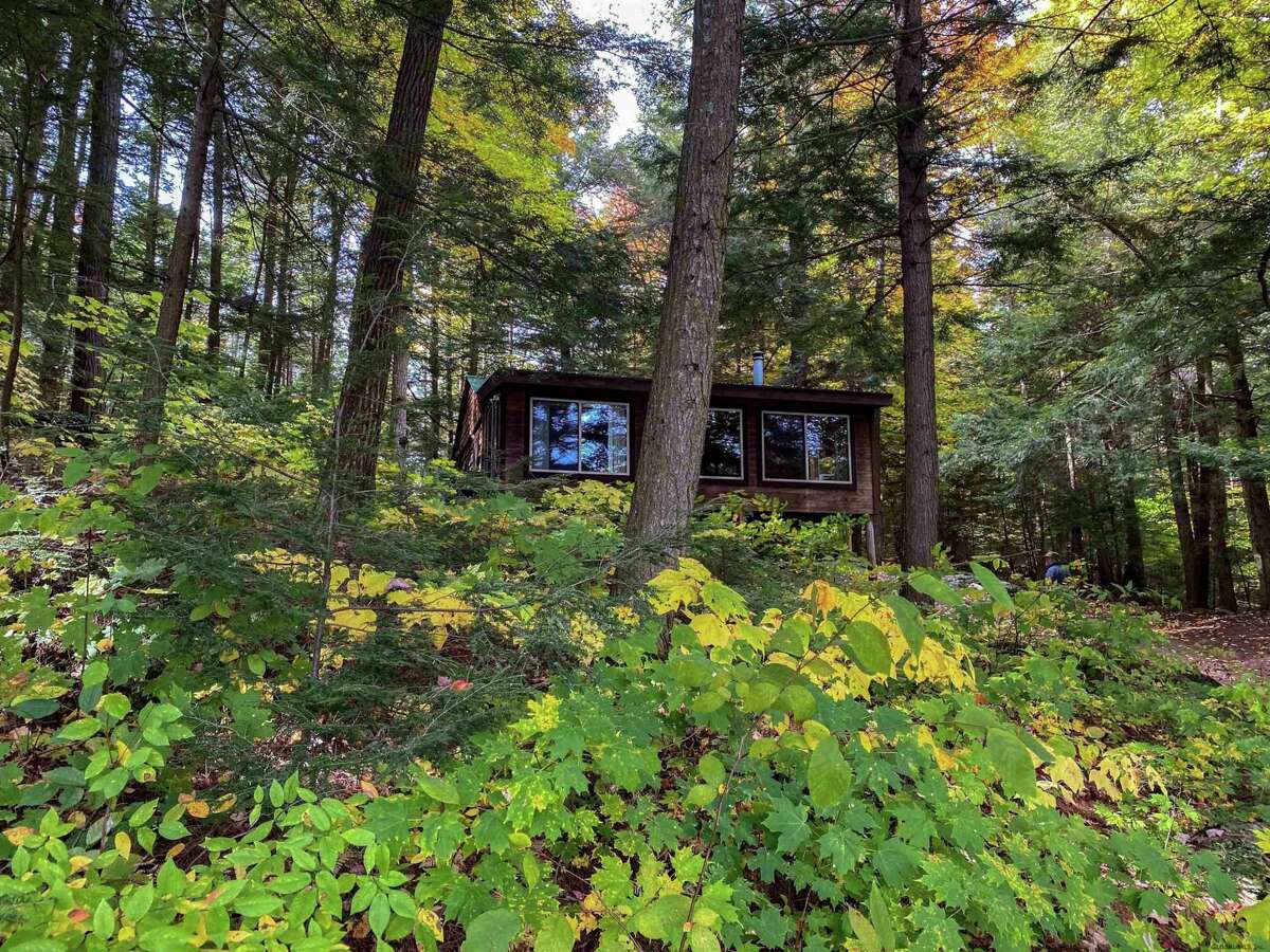 55 Red Fox La. Hague, NY PRICE: $2,200,000 DESCRIPTION: Four season waterfront home w/ 100' of shoreline in Arcady Bay on Northwestern Lake George. Captivating lake views, 2677sqft of living space, cathedral ceilings, 2-story 2-sided fireplace in the great room, 5BRs & 3 full BAs, lakeside screened porch & deck on main floor, lower level w/ family room, wood stove & bluestone patio. Lakeside patio steps down to a U-shaped articulating dock w/ sandy swimming. Arcady Bay's association amenities include a common beach & pavilion, tennis, backboards, basketball court, volleyball courts, shuffleboard, soccer & baseball fields & playground. Just minutes south of the charming hamlet of Hague, w/ easy access to Ti Country Club for golf/dining and Gore Mt for skiing. Walk/jog the Friendship Trail to the Silver Bay YMCA campus. 20 min north of Bolton. SIZE: 1831 square feet BEDROOMS: 5 MLS ID: 202116829 AGENT: Elaine Lawrence BROKERAGE: Sherwood Group, LLC Photos and listing copyright 2021 by Sherwood Group, LLC and associated MLS.