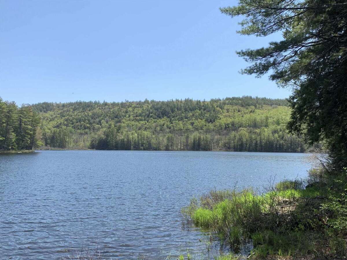 55 Red Fox La. Hague, NY PRICE: $2,200,000 DESCRIPTION: Four season waterfront home w/ 100' of shoreline in Arcady Bay on Northwestern Lake George. Captivating lake views, 2677sqft of living space, cathedral ceilings, 2-story 2-sided fireplace in the great room, 5BRs & 3 full BAs, lakeside screened porch & deck on main floor, lower level w/ family room, wood stove & bluestone patio. Lakeside patio steps down to a U-shaped articulating dock w/ sandy swimming. Arcady Bay's association amenities include a common beach & pavilion, tennis, backboards, basketball court, volleyball courts, shuffleboard, soccer & baseball fields & playground. Just minutes south of the charming hamlet of Hague, w/ easy access to Ti Country Club for golf/dining and Gore Mt for skiing. Walk/jog the Friendship Trail to the Silver Bay YMCA campus. 20 min north of Bolton. SIZE: 1831 square feet BEDROOMS: 5 MLS ID: 202116829 AGENT: Elaine Lawrence BROKERAGE: Sherwood Group, LLC Photos and listing copyright 2021 by Sherwood Group, LLC and associated MLS.