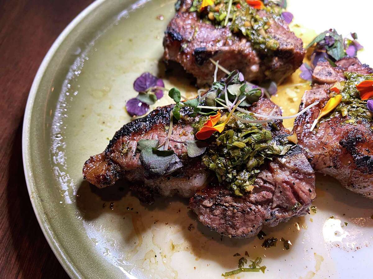 Lamb T-bones are grilled over oak and mesquite and finished with chimichurri at Landrace.