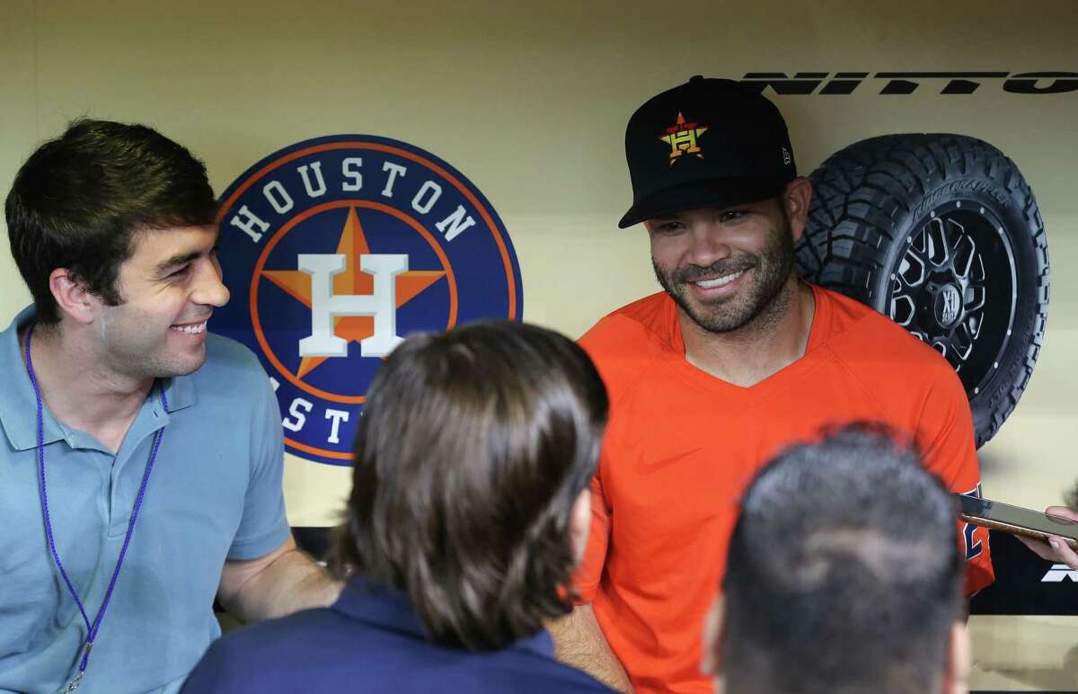 Houston Astros second baseman Jose Altuve (27) talks to reporters inside the dugout before an MLB game against the Oakland Athletics at Minute Maid Park on Thursday, July 8, 2021, in Houston.