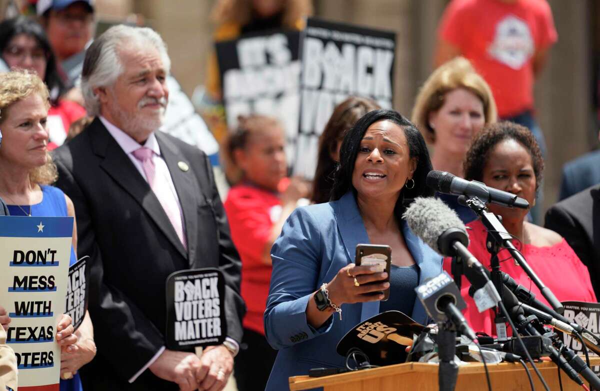Rep. Nicole Collier, D-Fort Worth, stands with other Democratic caucus members as she speaks at a rally on the steps of the Texas Capitol to support voting rights, Thursday, July 8, 2021, in Austin, Texas. (AP Photo/Eric Gay)