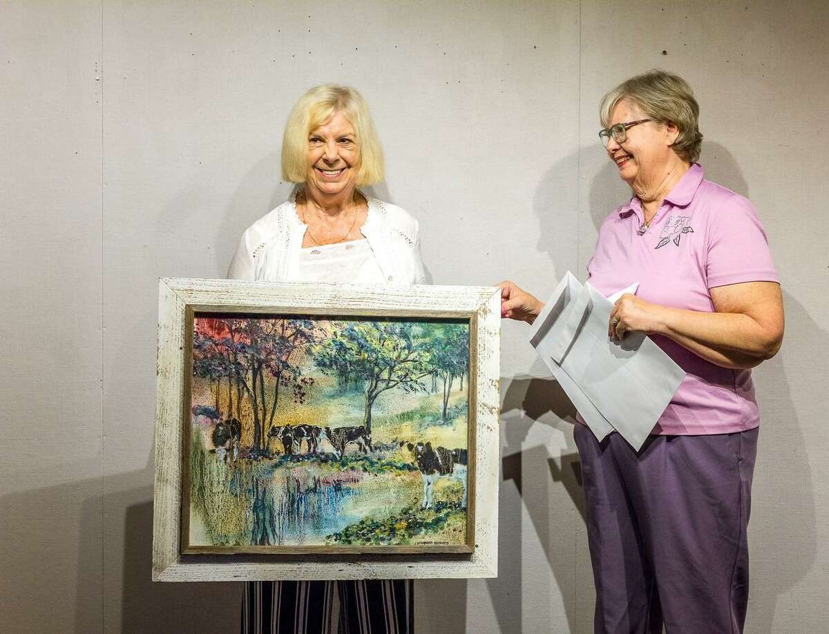 The Kent Art Association has announced its awards for its selected 2021 President’s Show, which began, June 20, with a date of conclusion, July 25. Sue Lapardo, KAA President, presenting Judith Beringer Hraniotis the Award for Excellence for her oil painting “Storm Watch.”