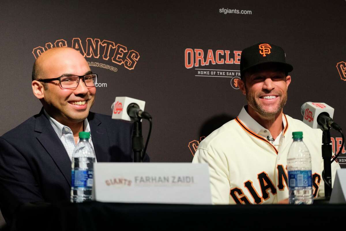 Giants executive Farhan Zaidi (left), with manager Gabe Kapler, spent 10 seasons working for the A’s before becoming a GM.
