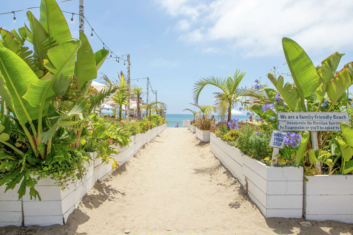 Access to the beach is down a path next to the restaurant's patio. 