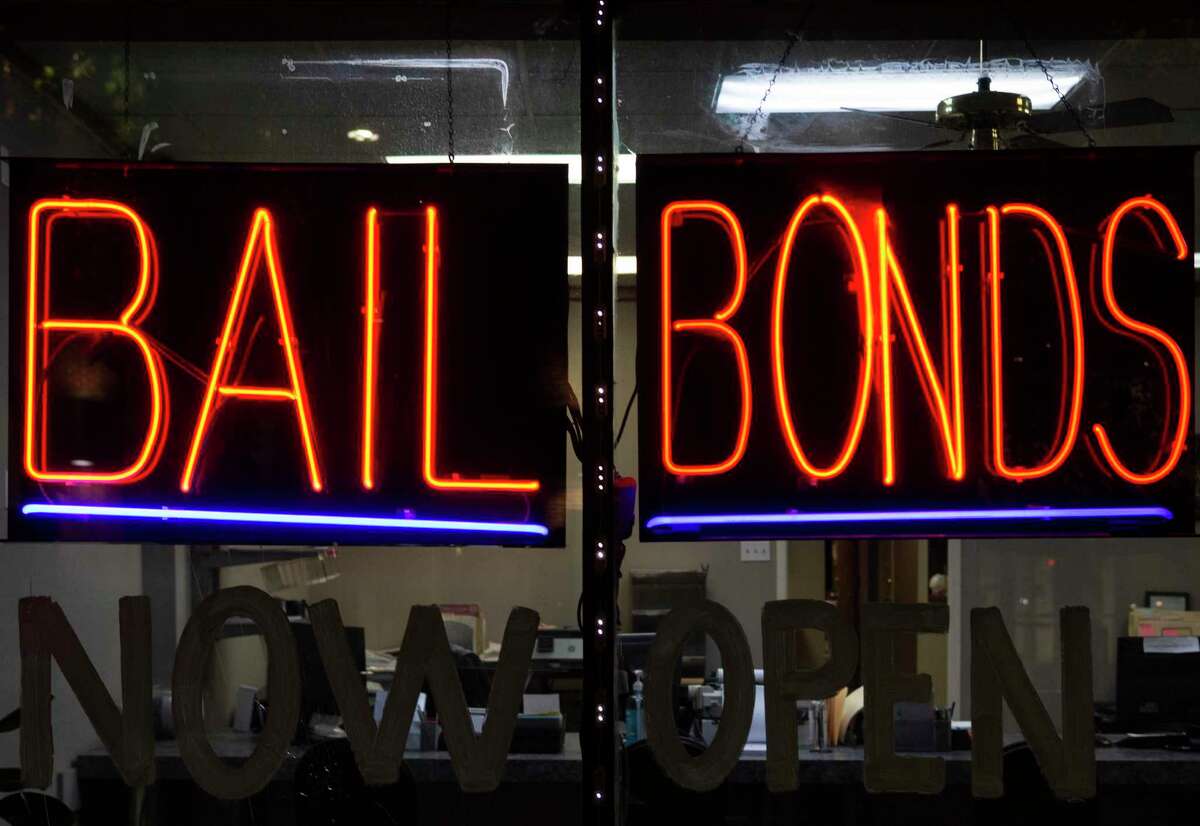 Action Bail Bonds is photographed at night Wednesday, June 30, 2021, in downtown Houston.