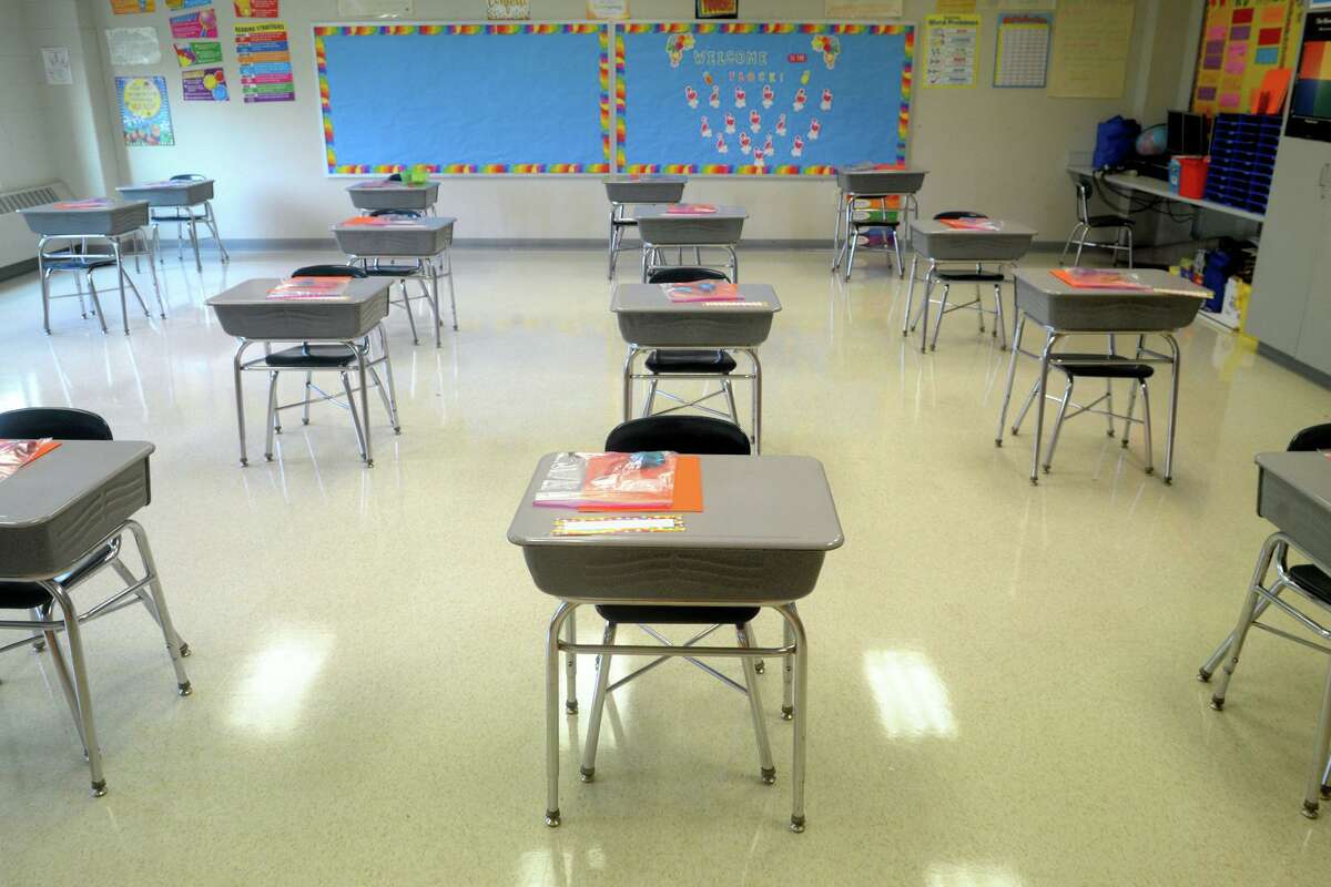 Desks are in place at a safe social distance in a classroom of Johnson School, in Bridgeport, Conn. Aug. 27, 2020.