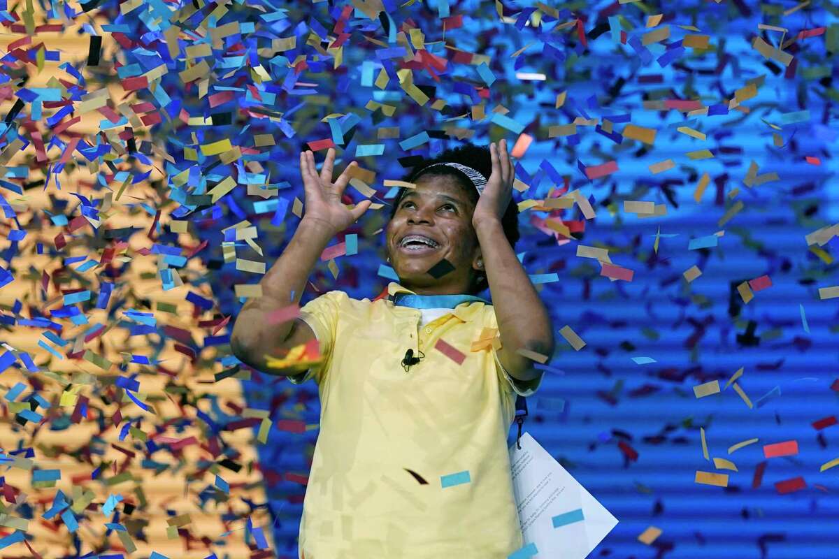Zaila Avant-garde, 14, from Harvey, Louisiana is covered with confetti as she celebrates winning the finals of the 2021 Scripps National Spelling Bee at Disney World Thursday, July 8, 2021, in Lake Buena Vista, Fla.