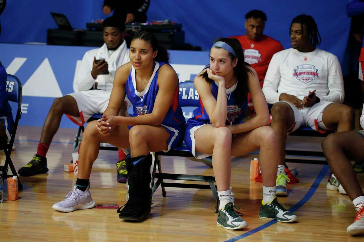 INDIANAPOLIS, IN - MARCH 30 : From left to right Azzi Fudd and Caroline Ducharme who both plan to attend UCONN watch during the three point shooting contest on March 30, 2021, during the American Family Insurance High School Slam Dunk & 3 Point Championships at Franklin Central High School in Indianapolis, IN. (Photo by Brian Spurlock/Icon Sportswire via Getty Images)