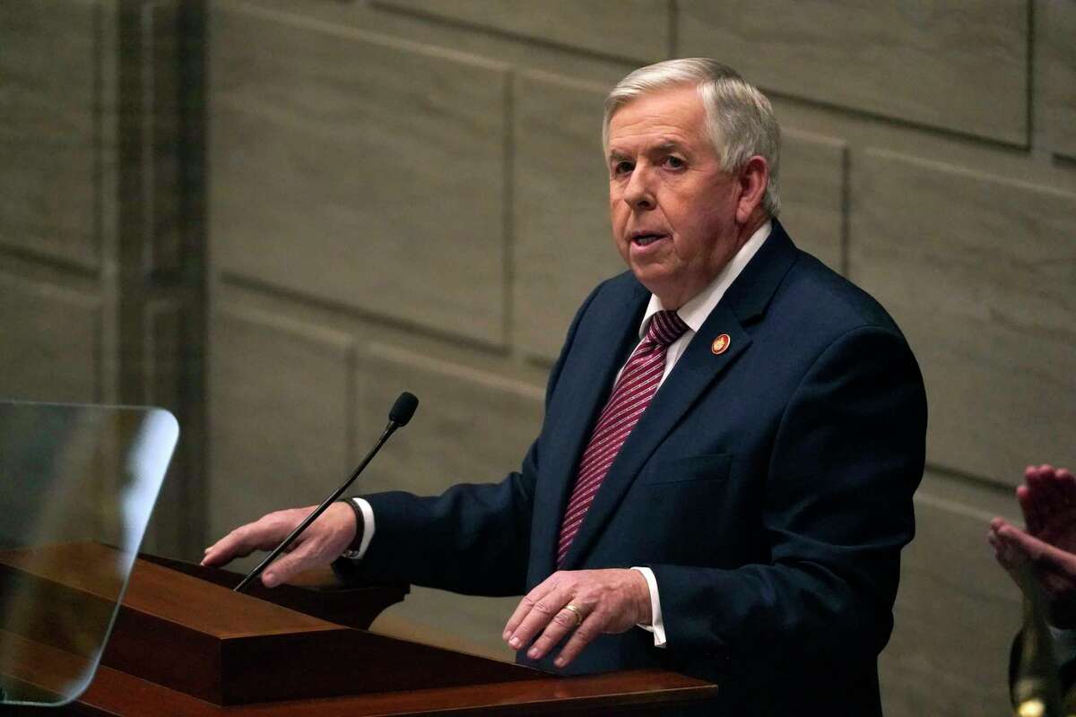 FILE - In this Jan. 27, 2021 file photo, Missouri Gov. Mike Parson delivers the State of the State address in Jefferson City, Mo. Federal officials are pushing back after Parson said he doesn't want government employees going door-to-door to urge people to get vaccinated. Missouri asked for help last week from nearly formed federal "surge response" teams as it combats an influx of cases that's overwhelming some hospitals.