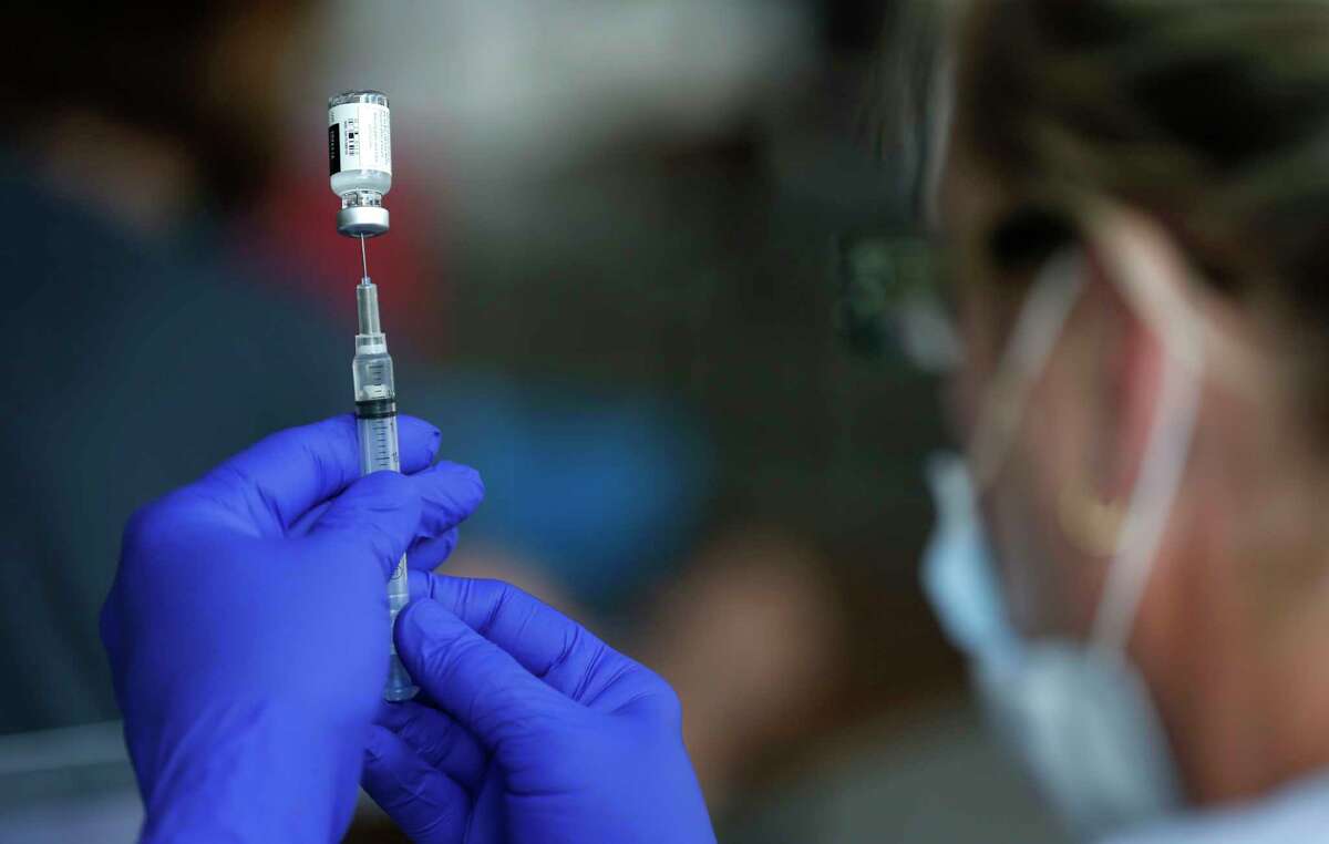 FILE - In this June 22, 2021, file photo, nurse Jody Berry draws a syringe full of the Johnson & Johnson COVID-19 vaccine at a clinic at Mother's Brewing Company in Springfield, Mo. (Nathan Papes/The Springfield News-Leader via AP)
