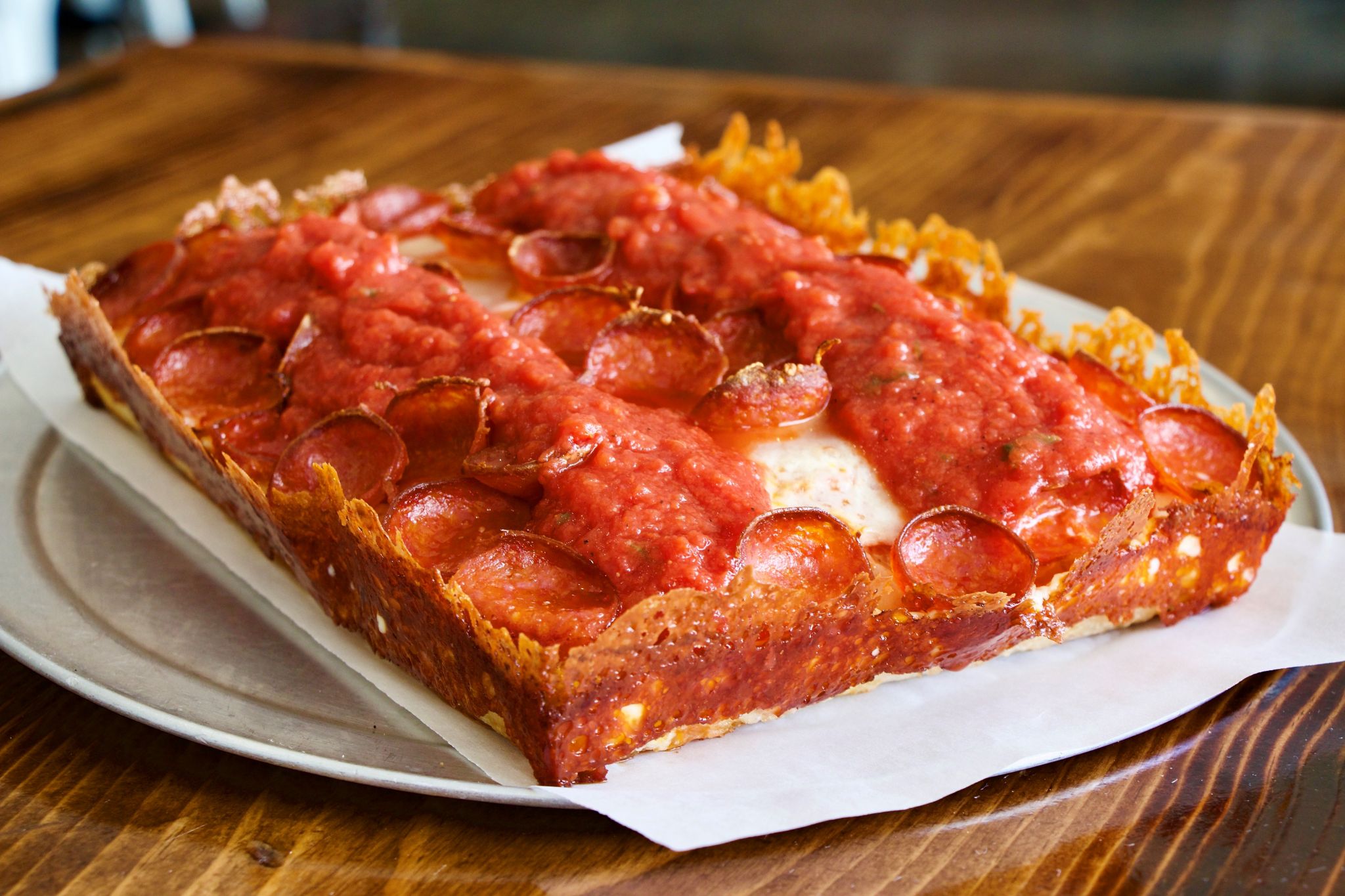 These Houston spots for regional pizza styles will satisfy your travel