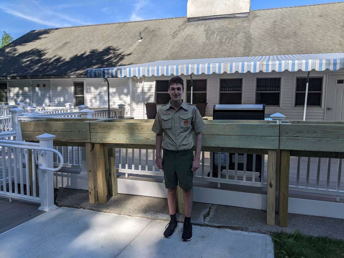 Ben SanServino, who is a Danbury resident, stands with four raised planters he recently made for the residents of the Pound Sweet Hill group home in Bethel, which is run by the nonprofit organization Ability Beyond. SanSeverino also recently built, and installed two accessible picnic tables for the residents.