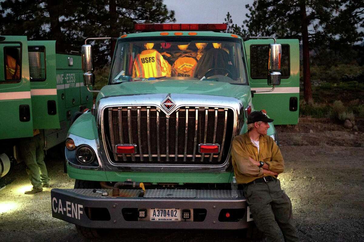 A U.S. Forest Service firefighter prepares to work an overnight shift while battling the Lava Fire in Weed (Siskiyou County).