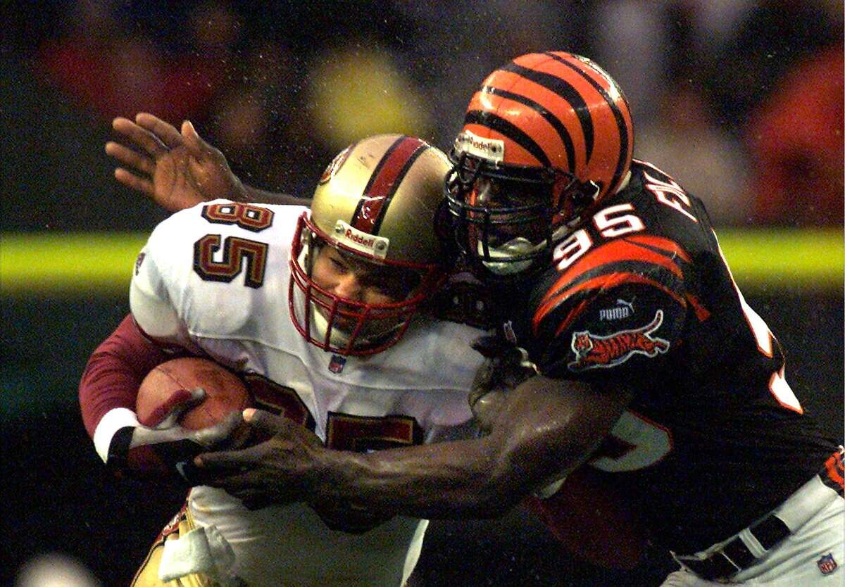 49ERS CLARK-C-05DEC99-SP-FRL: Bengel defense Steve Foley put a hit on Greg Clark in the 2nd quarter to stop him from getting a first down. Chronicle photo by Frederic Larson