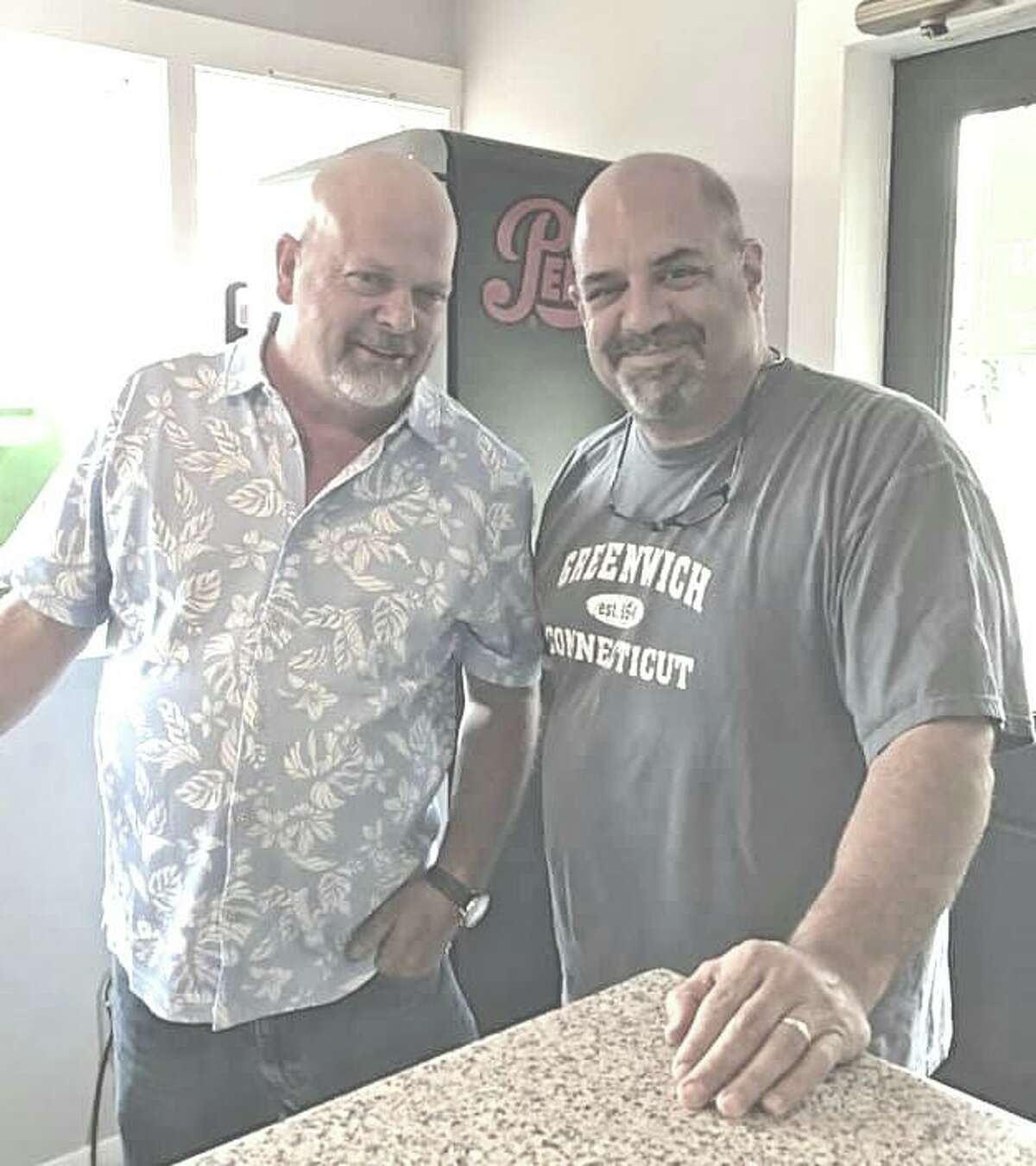 Dom Delfino, owner of Joey B's in Cos Cob, poses with TV personality Rick Harrison of ‘Pawn Stars’ at the restaurant.